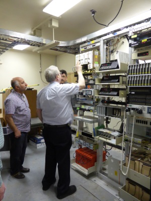 Clockwise from left: Ihab Elzaanoun (Caltrans District 6), Ian Turnbull (Caltrans District 2), and instructor Scott Baxter discuss operation and set-up for the communications links at the Woodland Maintenance Yard where the Telco Wireless class was held.