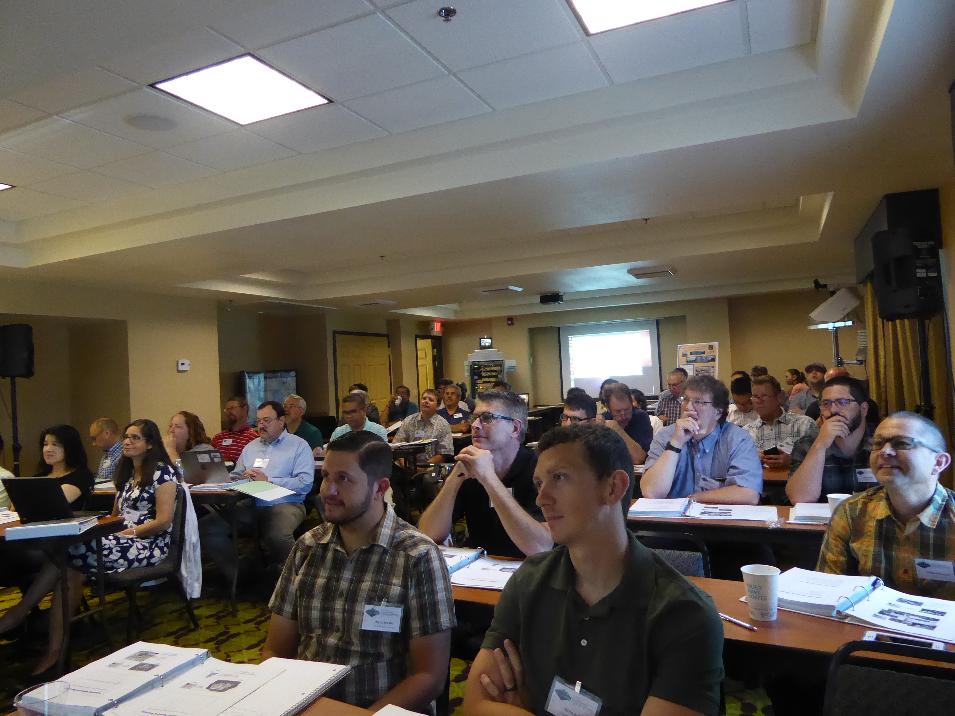 Participants of the 2017 Western States Forum watch a presentation.