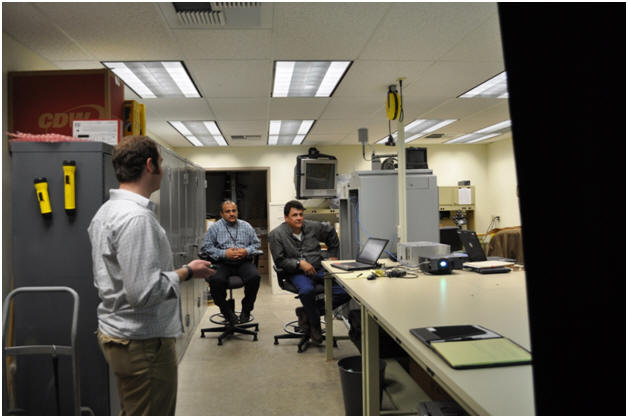 Kelvin Bateman listening to comments during the presentation with Mohammed Battah (left) and Ian Turnbull (right) sitting in the background. The meeting was held in Ian's lab. Kelvin Bateman listening to comments during the presentation with Mohammed Battah (left) and Ian Turnbull (right) sitting in the background. The meeting was held in Ian's lab.