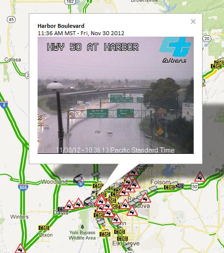 CCTV at HWY 50 and Harbor Blvd in Sacramento displaying stormy weather conditions along highway.