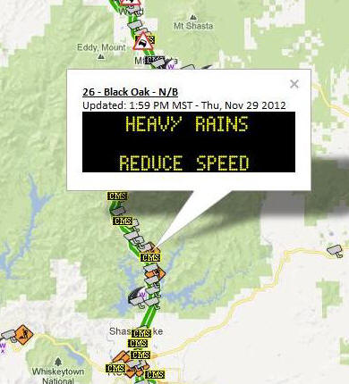 Road warning at I-5 and Black Oak North Bound displaying: Heavy Rains, Reduce Speed.