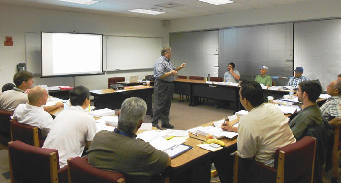 Course instructor Eric Pearson gives an example to explain a concept during a course lecture.