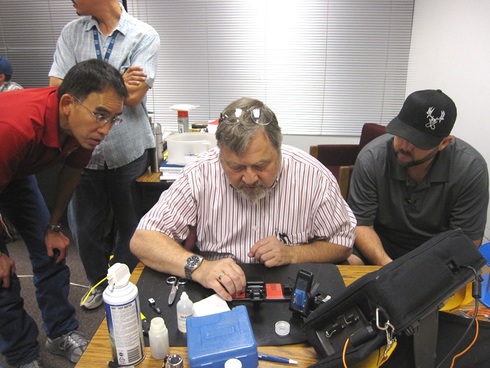 Mechanical splice demonstration with instructor Eric Pearson in the center.  Left to right:  Steven Gee (District 5), Dave Le (District 6), Will Lyons (District 9).
