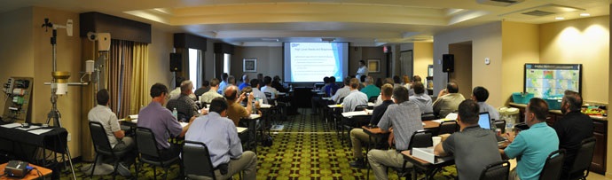 Participants at the 2015 Forum listen to a technical presentation. Participants at the 2015 Forum listen to a technical presentation.
