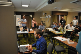 Jeremiah Pearce (front, seated) and Lonnie Hobbs (back, standing), Caltrans District 2, end their presentation with a demonstration during the 2017 Forum. Jeremiah Pearce (front, seated) and Lonnie Hobbs (back, standing), Caltrans District 2, end their presentation with a demonstration during the 2017 Forum.