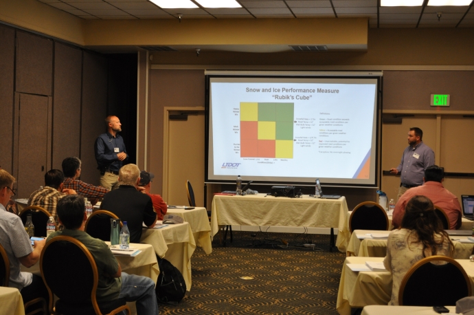 UDOT meteorologists Jeff Williams (left) and Cody Oppermann (right) explain the matrix showing potential for improved road conditions given the weather conditions.