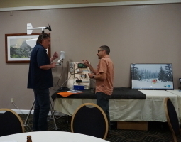 Jeff Worthington explains and discusses with Stephen Donecker the equipment on display.