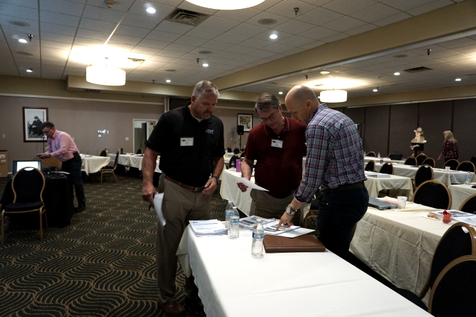 Networking during an extended break between technical presentations.