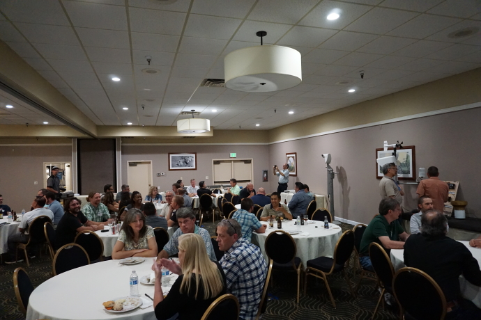 Multiple groups visit during the Tuesday evening reception and meal.