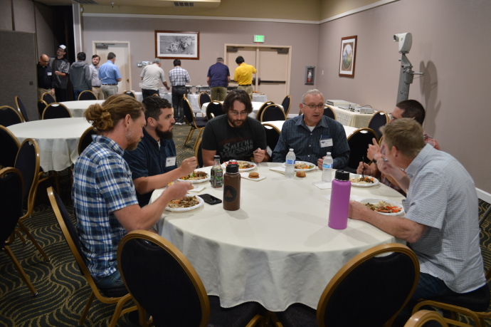 Caltrans District 2 and 3 employees networking during a lunch meal.