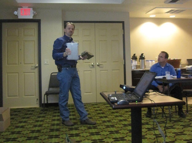 Tim McDowell shows several radios used by WSDOT.