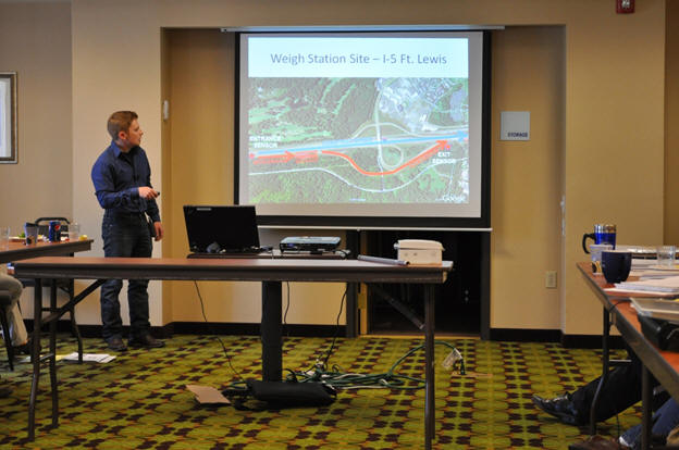 Yegor Malinovskiy shows the project test site at a weigh station along I-5 at Fort Lewis.