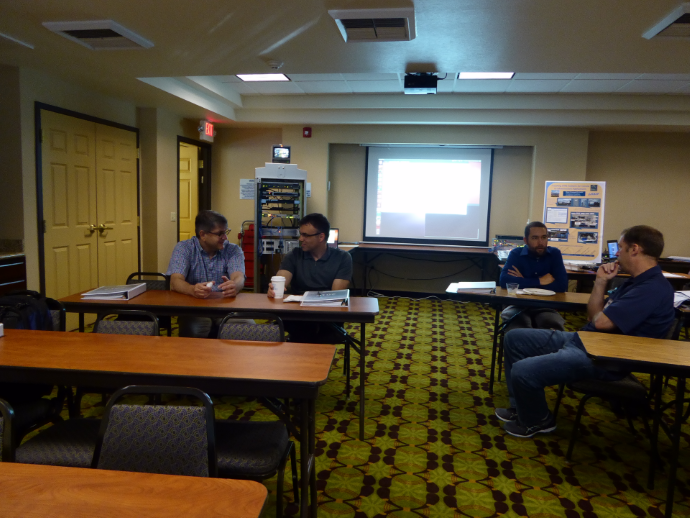 Before the technical program begins on Wednesday morning, several repeat attendees visit with each other. Left to right: Sean Campbell, Caltrans DRISI; Doug Spencer, Oregon DOT; Jeremiah Pearce, Caltrans District 2; and Brian Simi, Caltrans Headquarters. Before the technical program begins on Wednesday morning, several repeat attendees visit with each other. Left to right: Sean Campbell, Caltrans DRISI; Doug Spencer, Oregon DOT; Jeremiah Pearce, Caltrans District 2; and Brian Simi, Caltrans Headquarters.