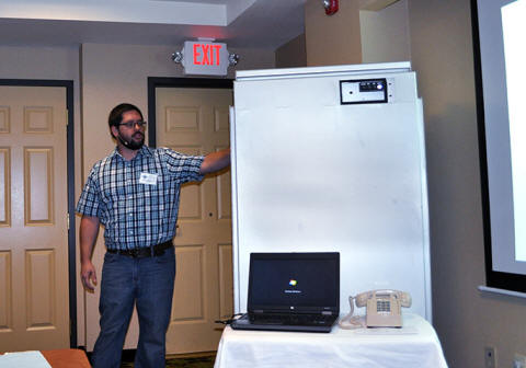 Keith Koeppen of Caltrans District 2 shows various componenents of the Safety Chain Control System cabinet.