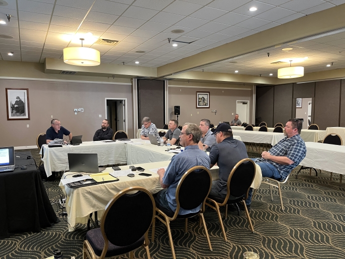 WSRTC meeting attendees A group of people sit at tables arranged in a semi-circle.